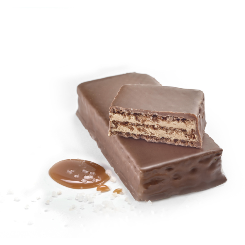 Beauty shot of butterscotch & sea salt protein wafers showing the crispy wafer interior with sea salt granules and a butterscotch drop on the side